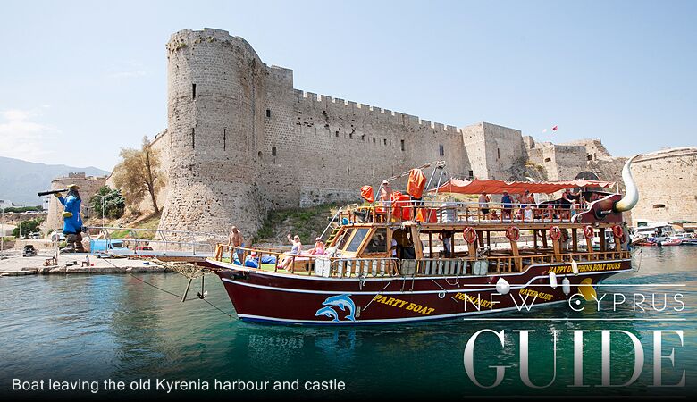 Boat leaving the old Kyrenia harbour and castle